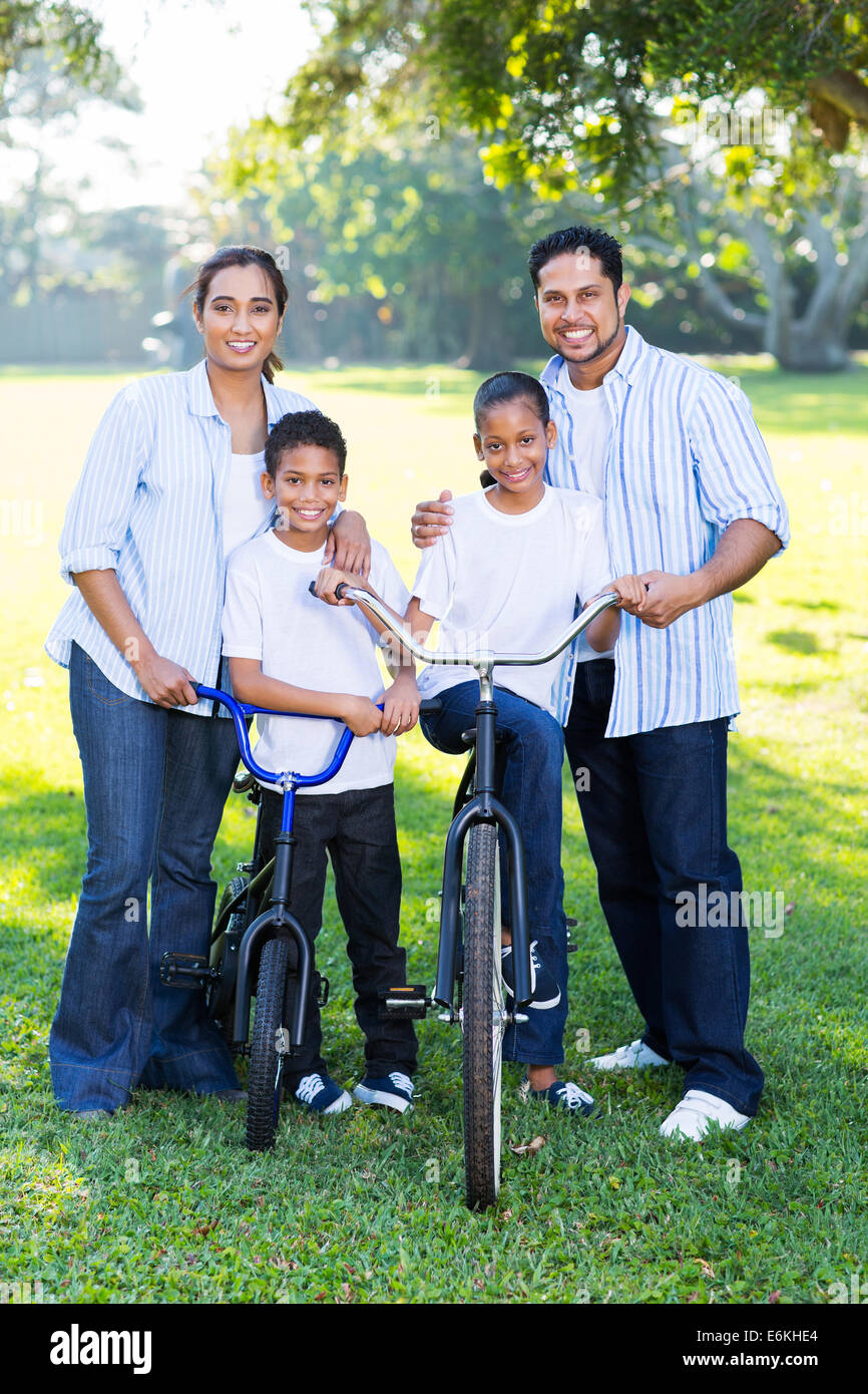 happy young Indian family of four portrait outdoors Stock Photo - Alamy