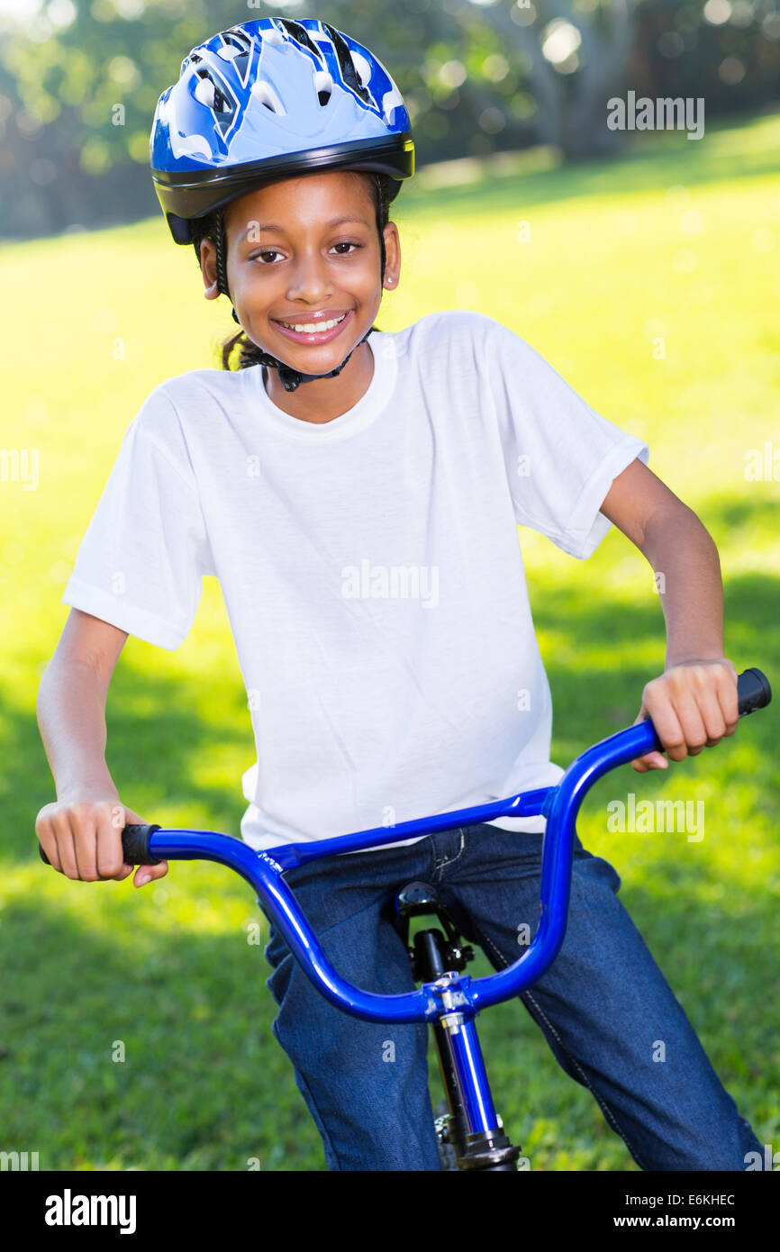 beautiful young African girl riding a bike outdoors Stock Photo Alamy