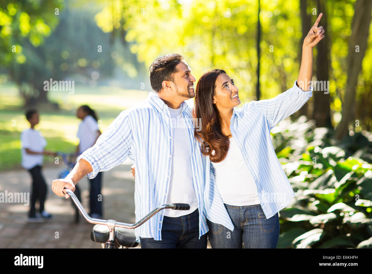 happy Indian couple and kids enjoying being outdoors Stock Photo - Alamy