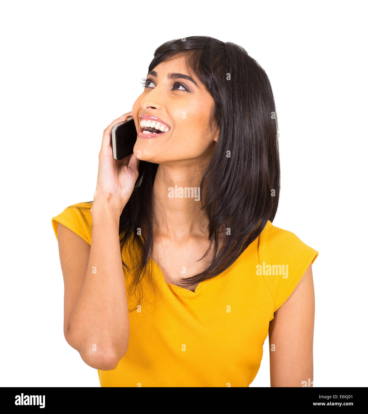 cheerful Indian woman talking on cell phone Stock Photo