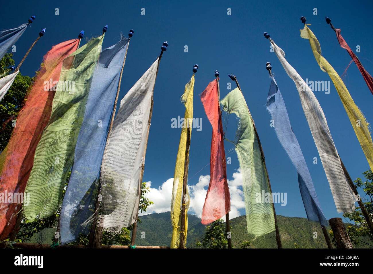 Eastern Bhutan, Mongar, Yadi, colourful prayer flags beside highway to Trashigang Stock Photo