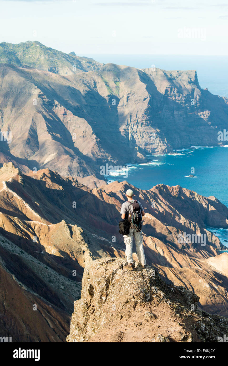 St Helena South Atlantic with climber looking toward Sandy bay in the south of the island Stock Photo