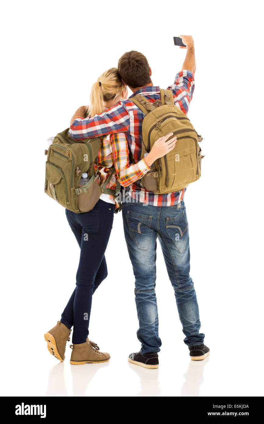 back view of couple taking selfie with their smart phone Stock Photo