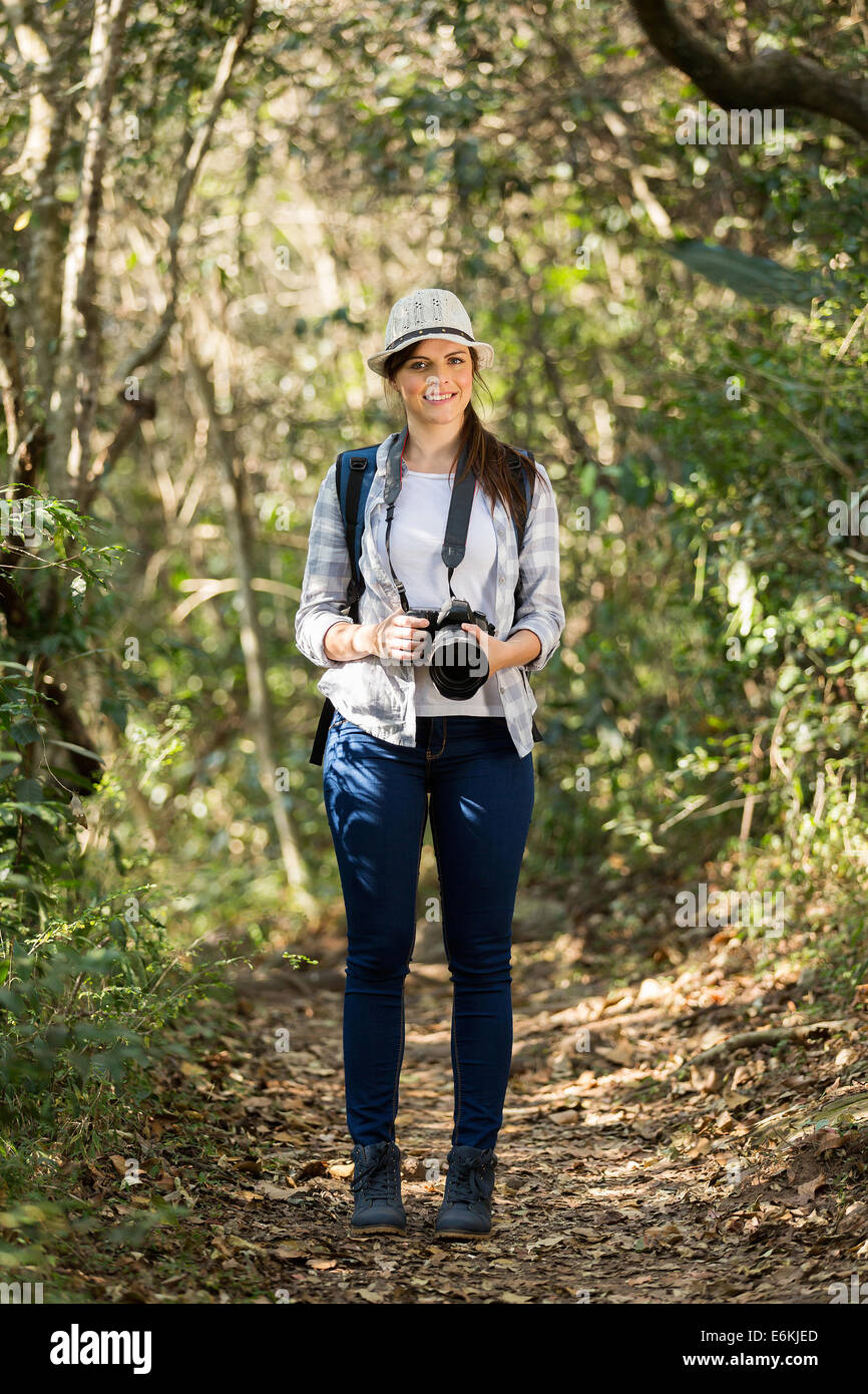 pretty young woman mountain climbing Stock Photo