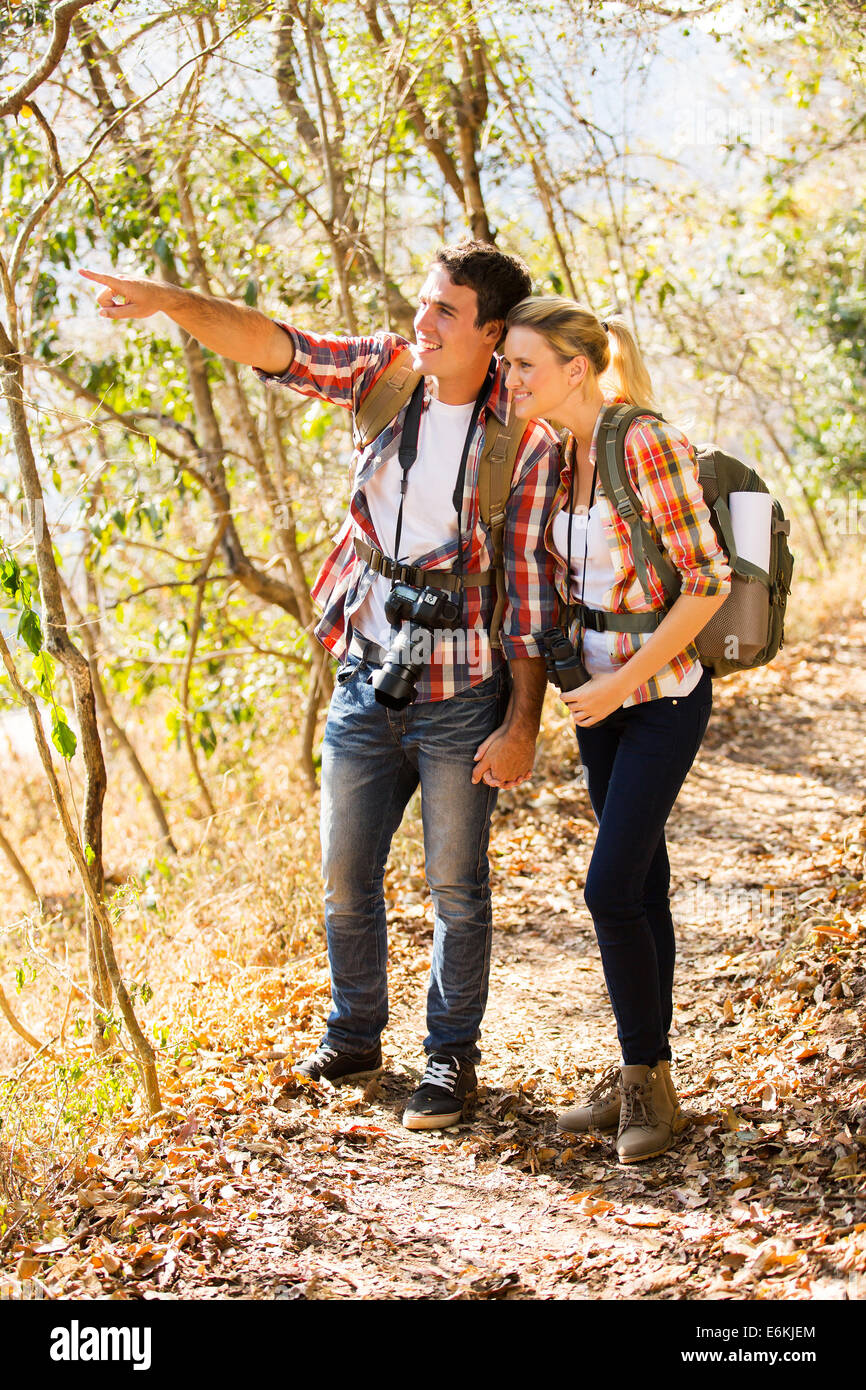 happy young couple mountain climbing together Stock Photo