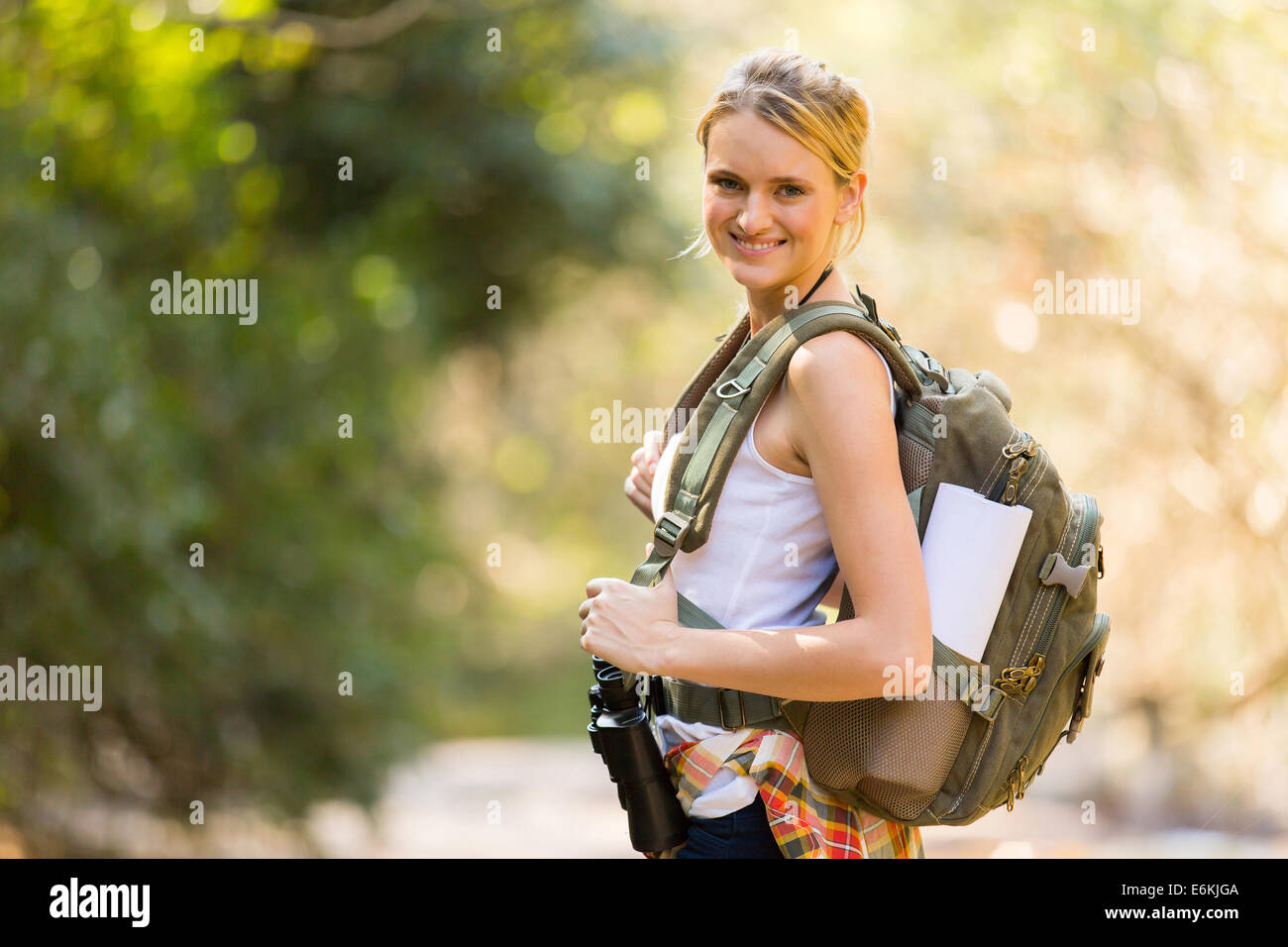 attractive young woman mountain climbing Stock Photo