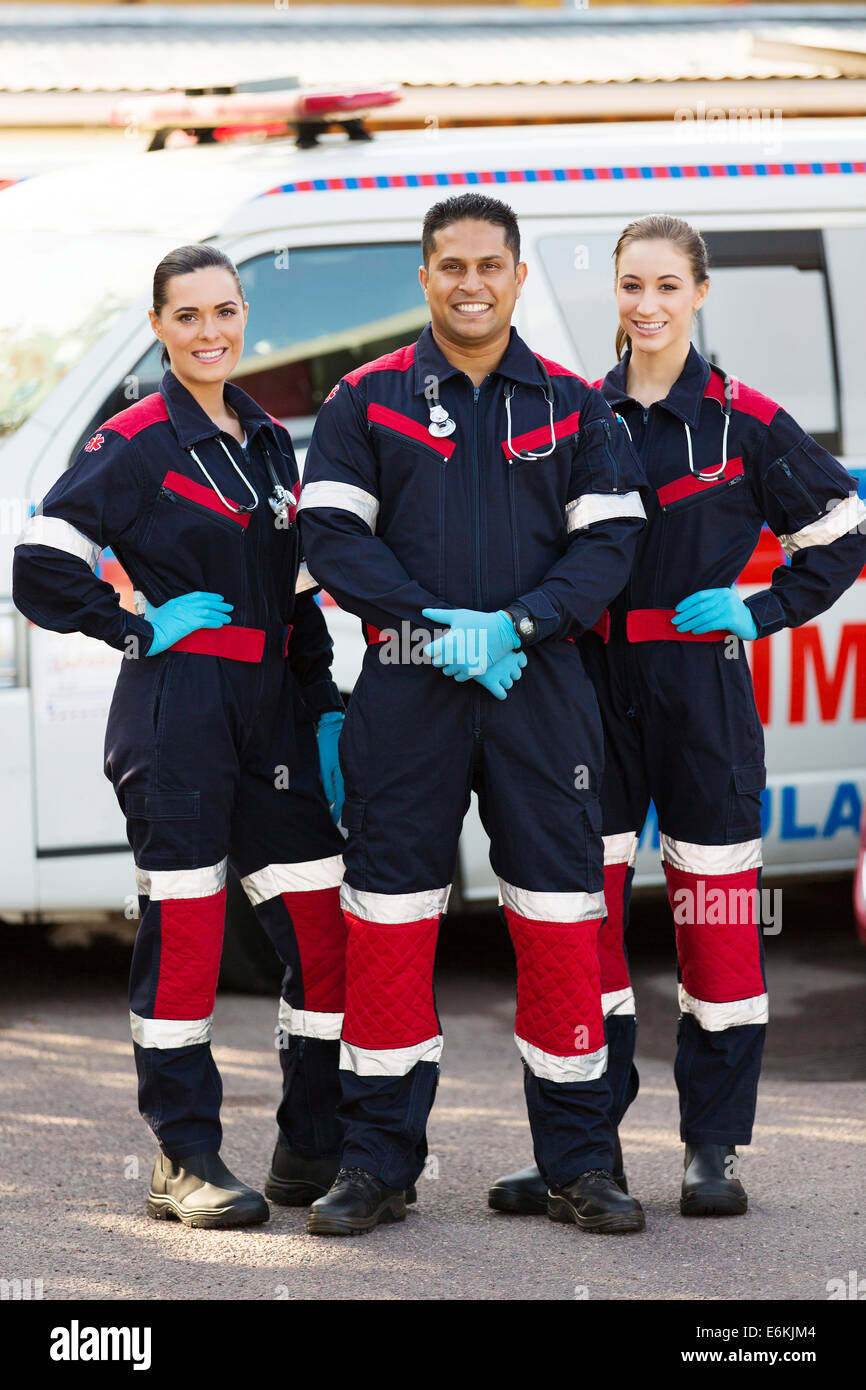group of emergency medical service team in front of ambulance Stock