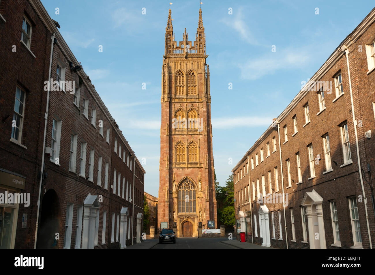 Early evening sunlight striking the tower of St Mary Magdalen church in Taunton, seen along Hammet Street. Stock Photo