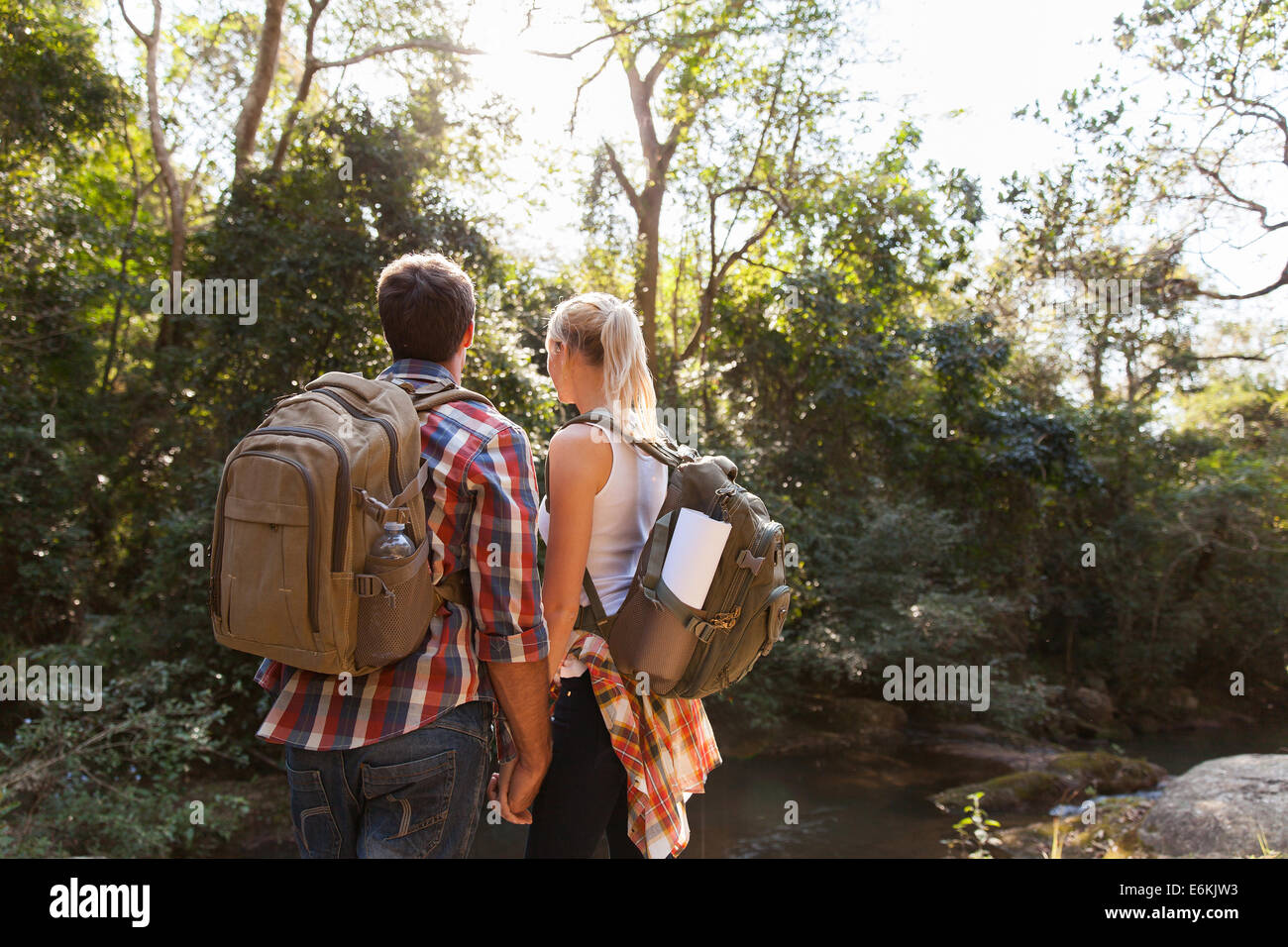 young couple hiking outdoors in the mountain Stock Photo - Alamy