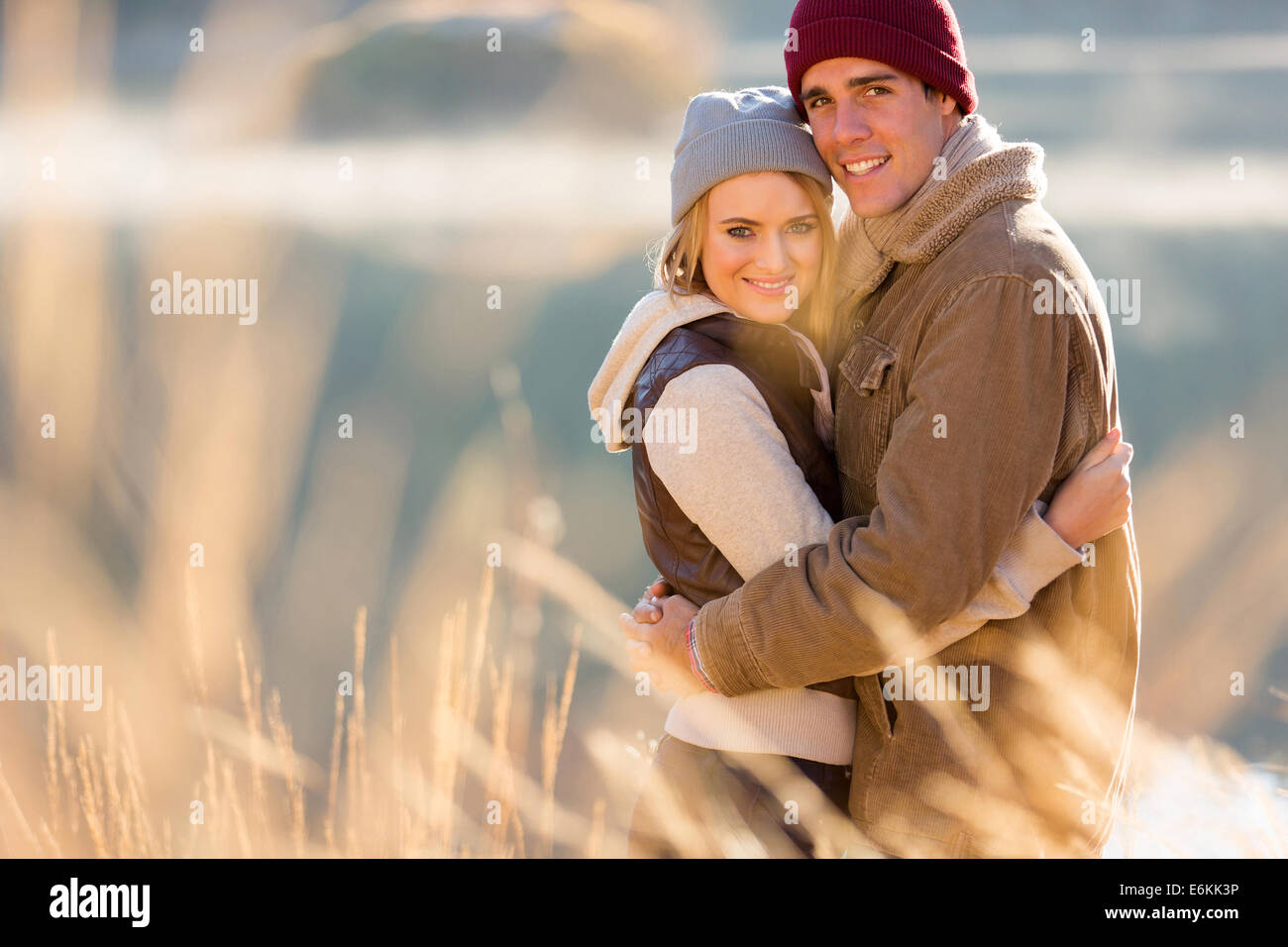 portrait of smiling young couple hugging in autumn morning Stock Photo ...