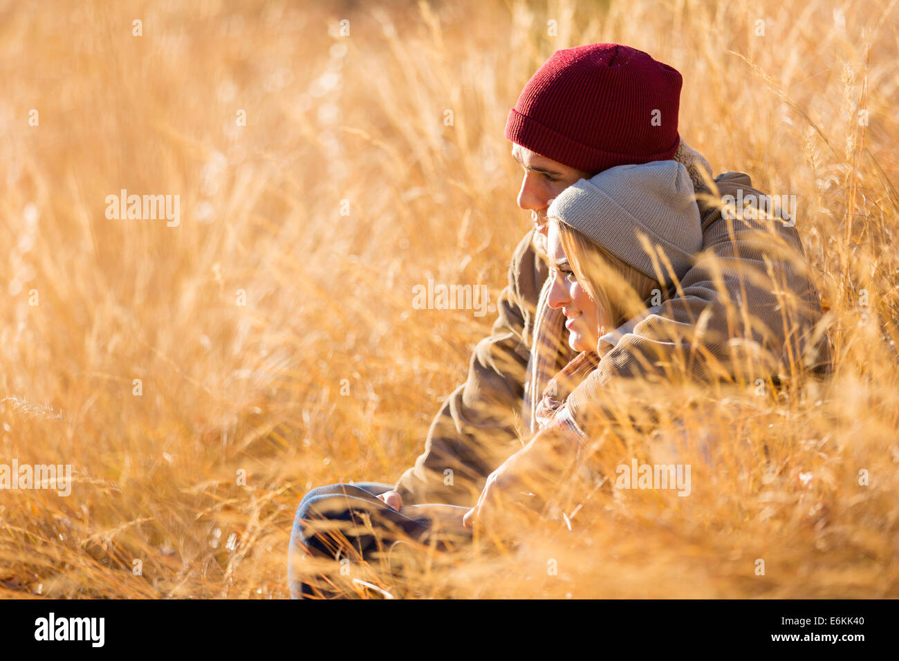 loving young couple sitting outdoors in autumn Stock Photo - Alamy