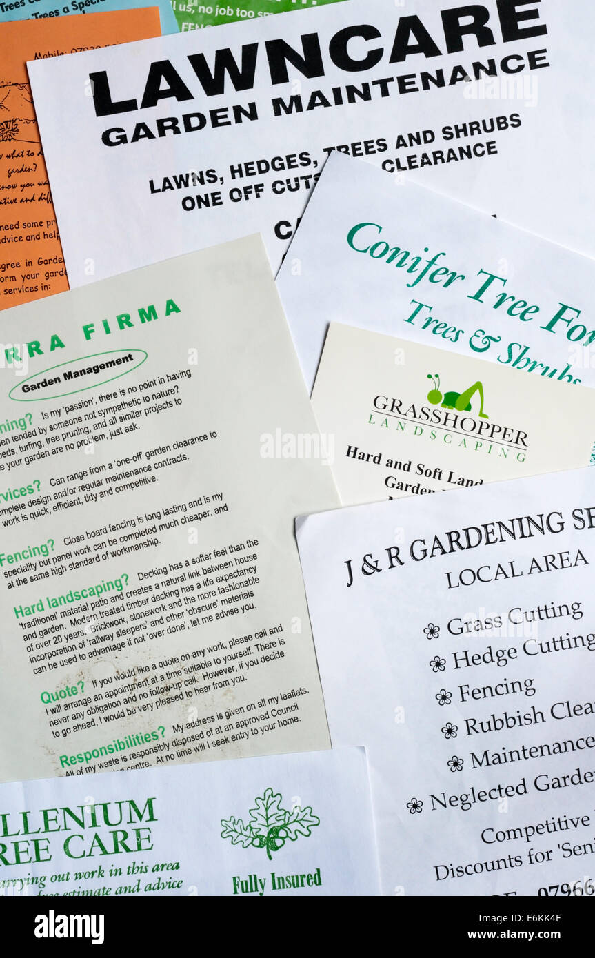 Junk mail leaflets delivered door to door from small or one-man businesses seeking gardening or tree work. Stock Photo