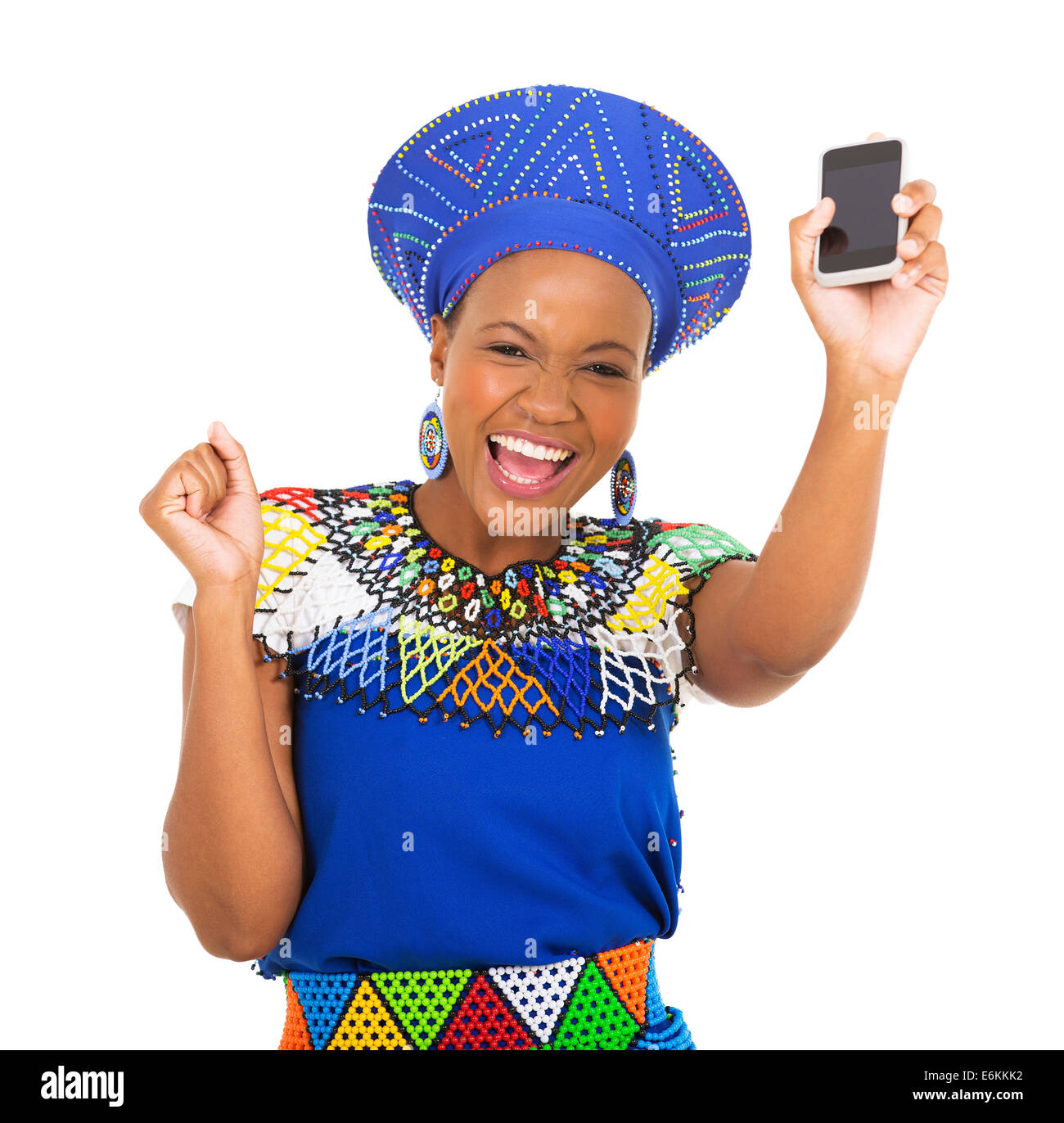 excited south African woman holding mobile phone Stock Photo