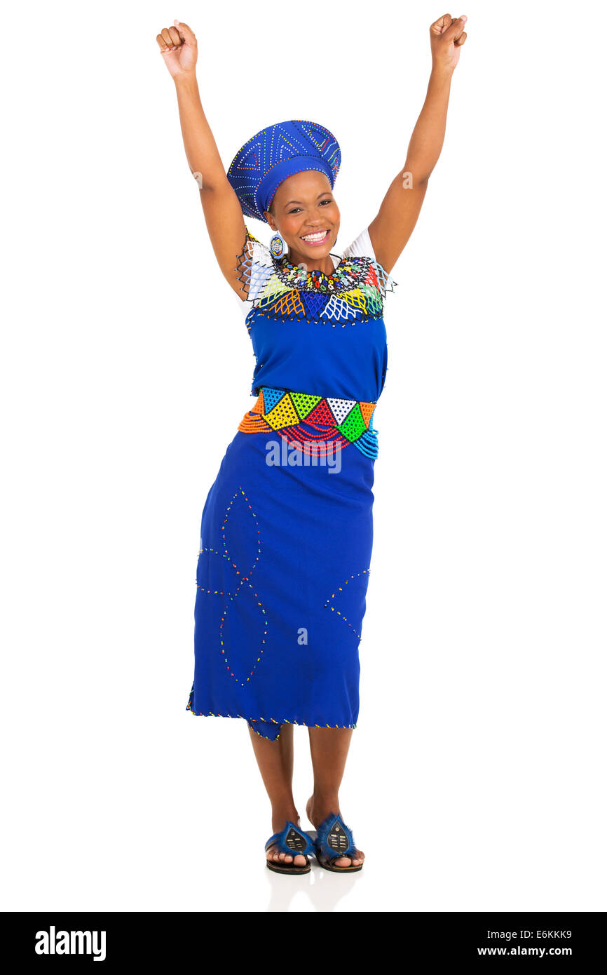excited south African woman in traditional clothes arms up Stock Photo