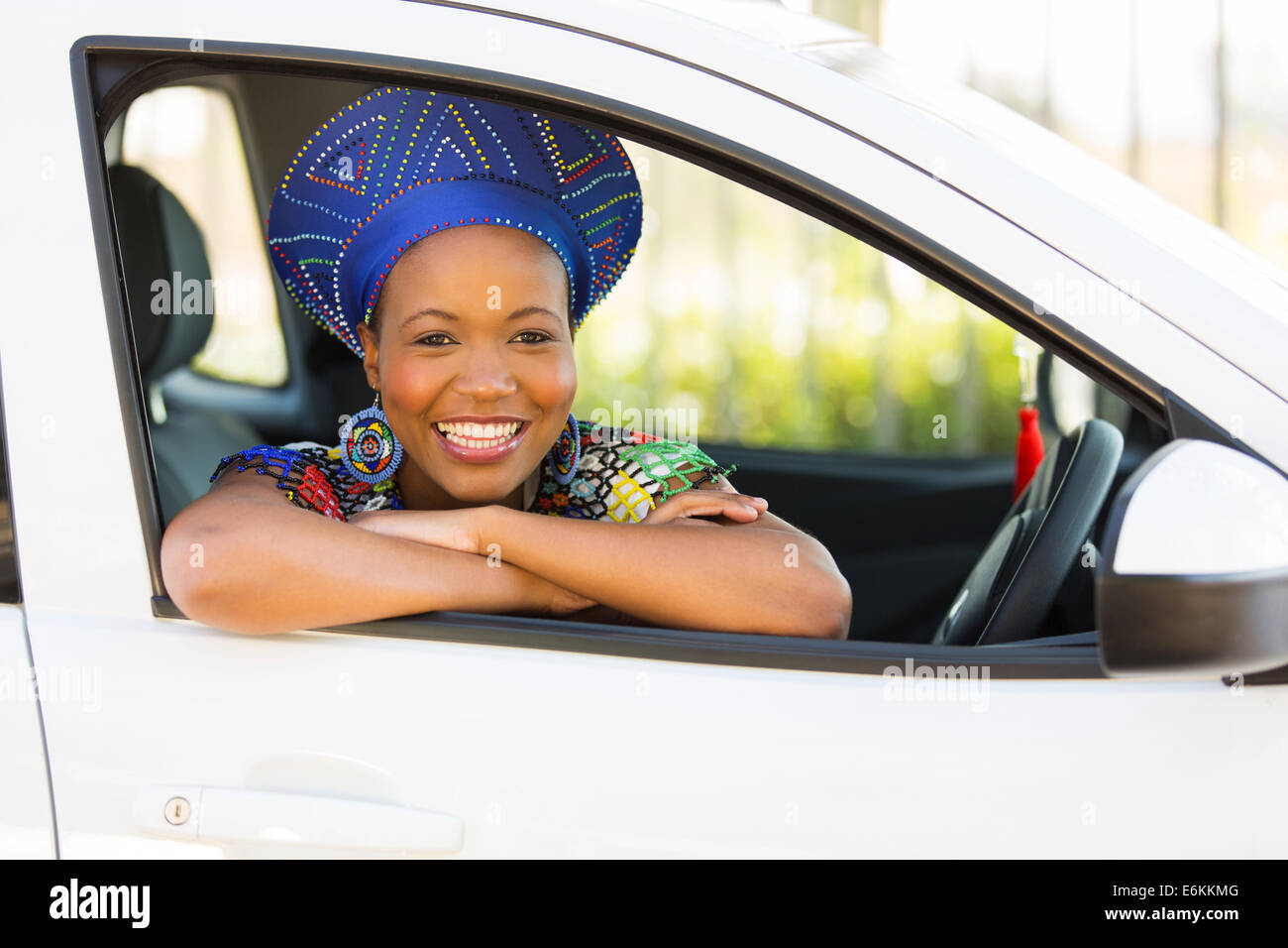 beautiful African girl inside her new car Stock Photo