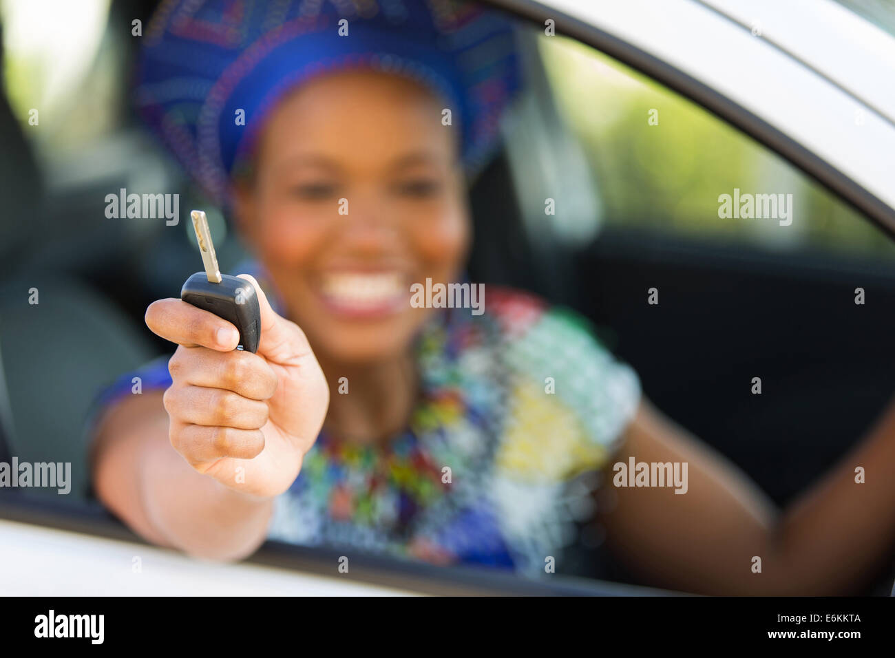 African Zulu woman showing car key inside new vehicle Stock Photo