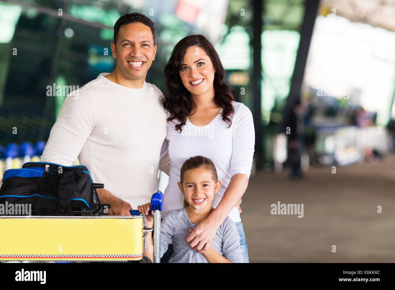 happy travelling family standing at airport Stock Photo