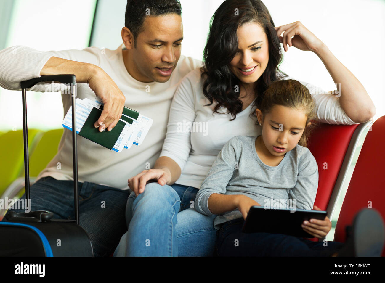 modern family using tablet computer at airport Stock Photo