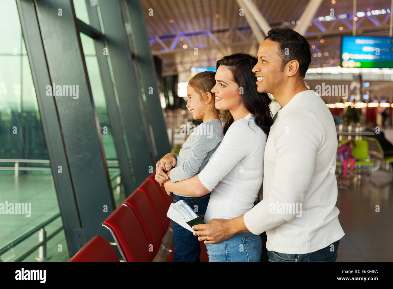 cute family waiting at airport Stock Photo