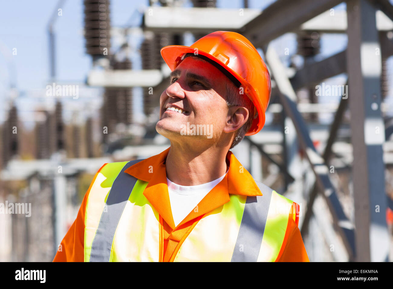 smiling mature male electrician in electrical substation Stock Photo