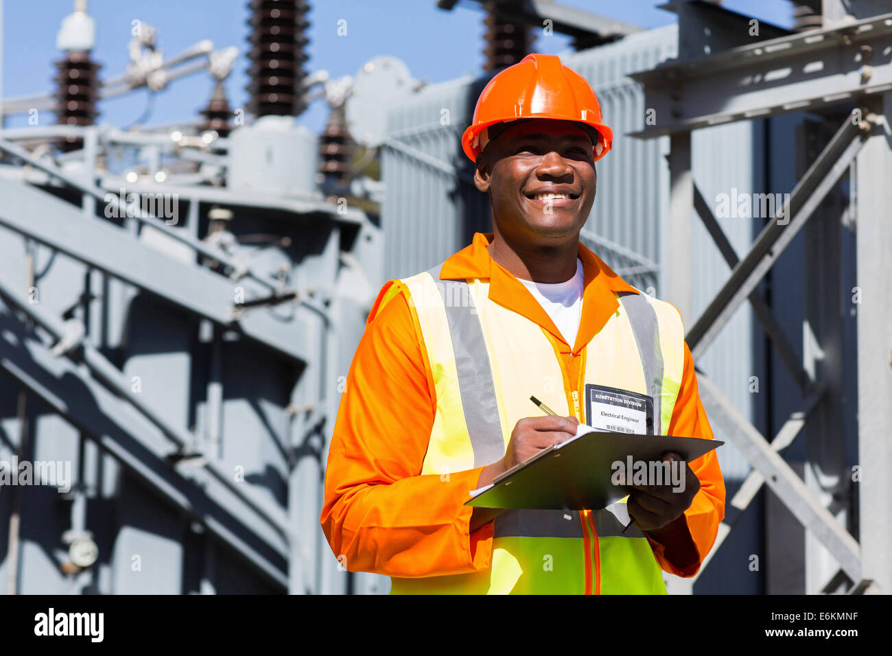 young African technician working in electrical substation Stock Photo