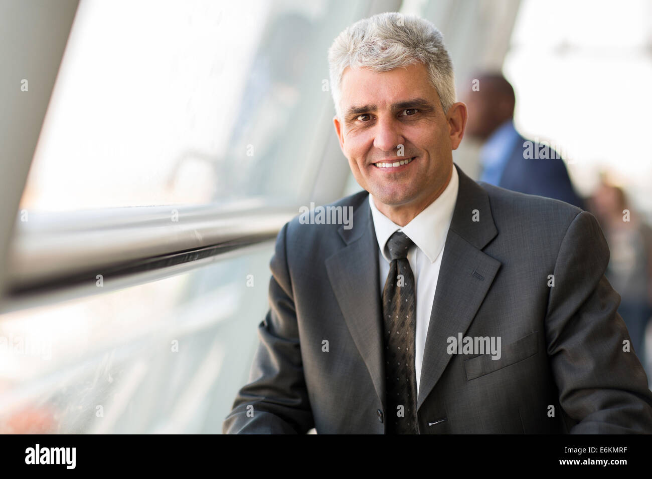 handsome middle aged businessman in modern office Stock Photo