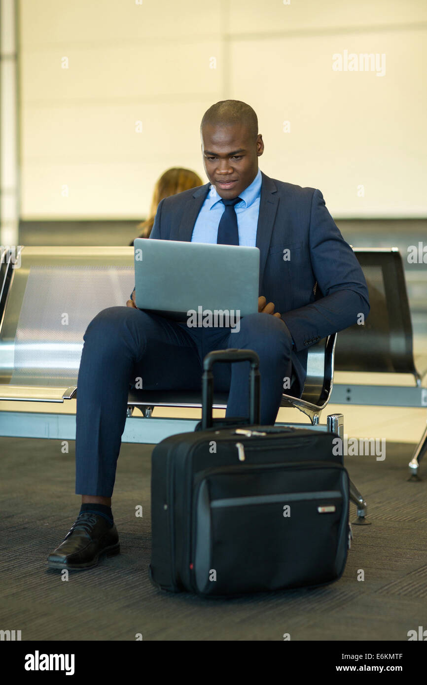 Young businessman after arriving. Comfortable airport, work trip, business  lifestyle. African-american male model with luggage after coming to end  point of his trip. Leaving terminal with documents Stock Photo - Alamy