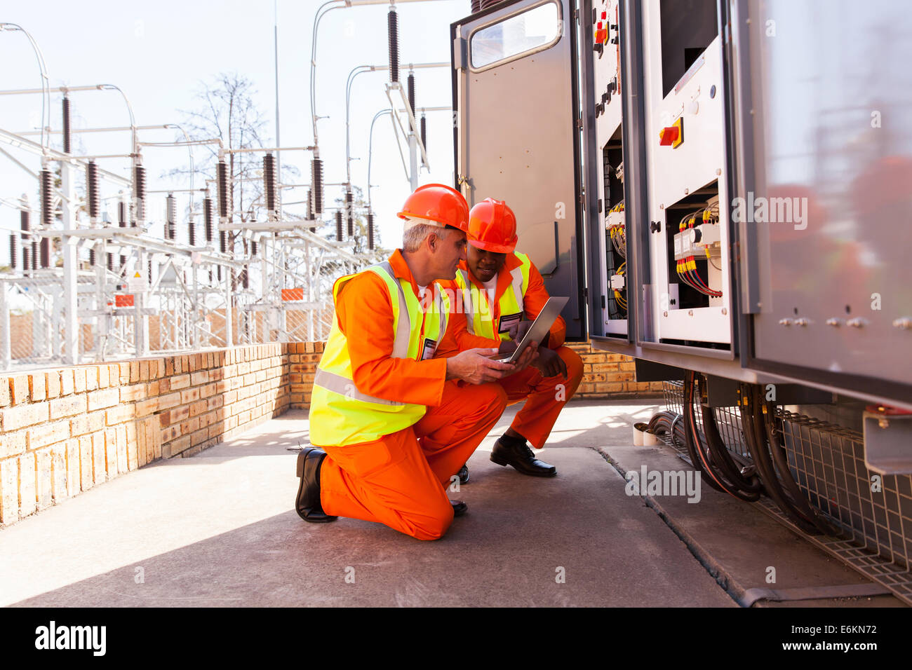 two electrical engineers discussing work in substation Stock Photo - Alamy