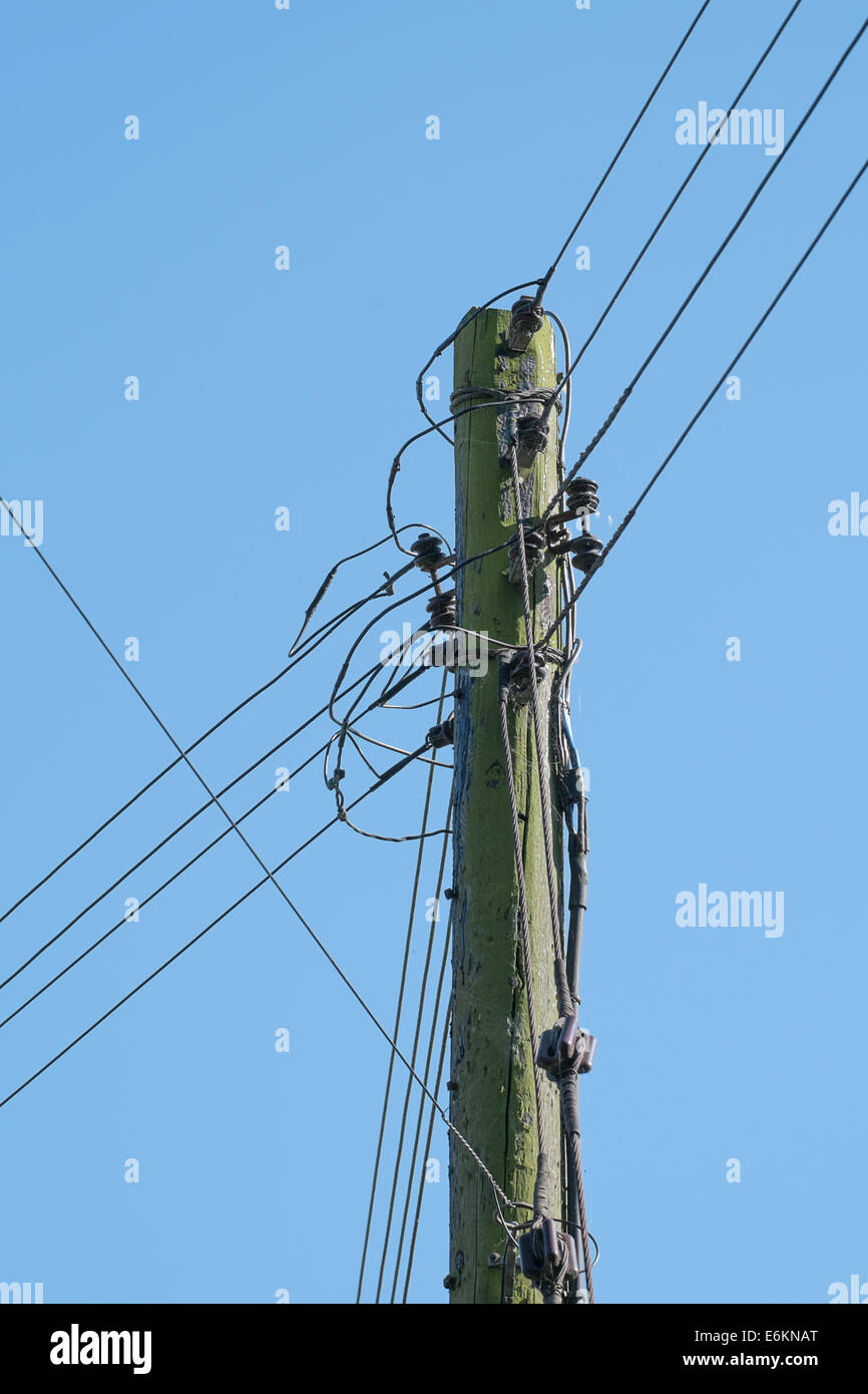 wooden telegraph pole with telephone wires connected Stock Photo