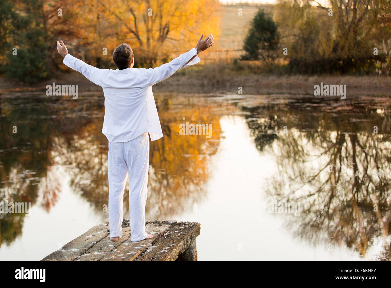 Man free standing arms up hi-res stock photography and images - Alamy