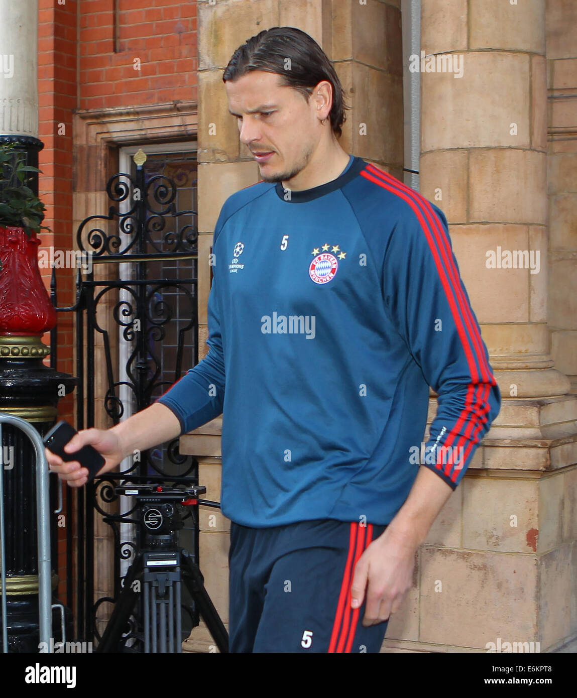 FC Bayern Munich leave their London hotel for a training session at QPR's Loftus Road Stadium before tonight's Champions League match against Arsenal  Featuring: Daniel Van Buyten Where: London, United Kingdom When: 19 Feb 2014 Stock Photo