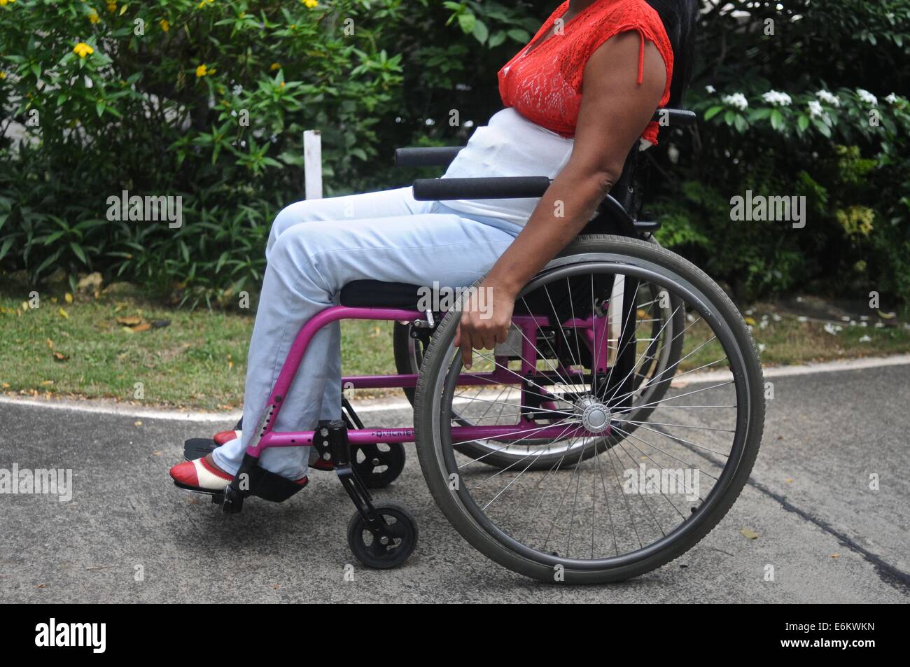 Latin woman in her thirties on a wheel chair Stock Photo
