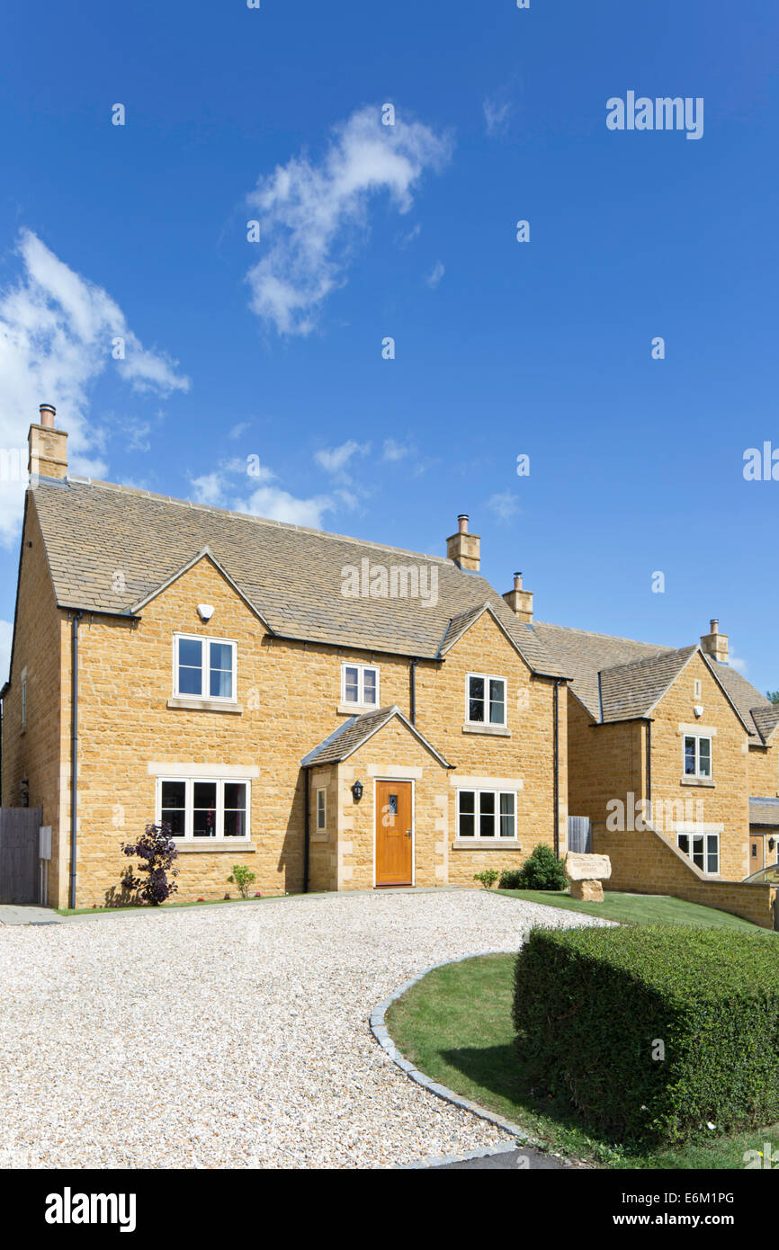 Modern housing using Cotswold stone, the Cotswolds, England, UK Stock