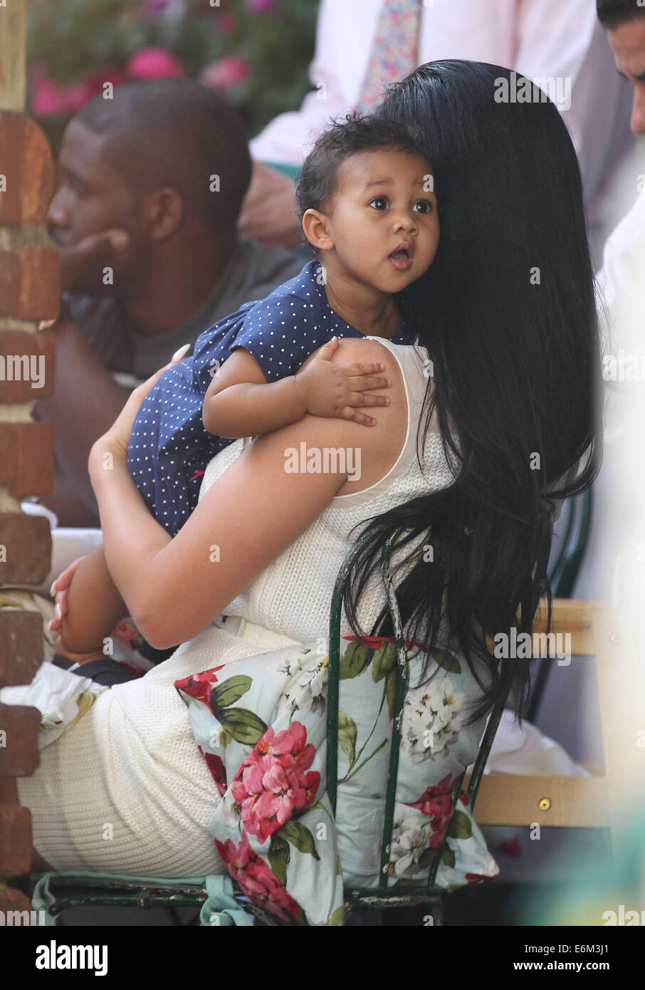 Reggie Bush, Lilit Avagyan and their baby daughter, Briseis having lunch at The Ivy on Robertson Boulevard in West Hollywood  Featuring: Briseis Bush,Lilit Avagyan,Reggie Bush Where: Los Angeles, California, United States When: 20 Feb 2014 Stock Photo