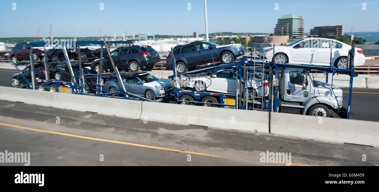 Car carrier tractor trailer with new Subaru cars on I-95 South in New Haven, CT. Stock Photo