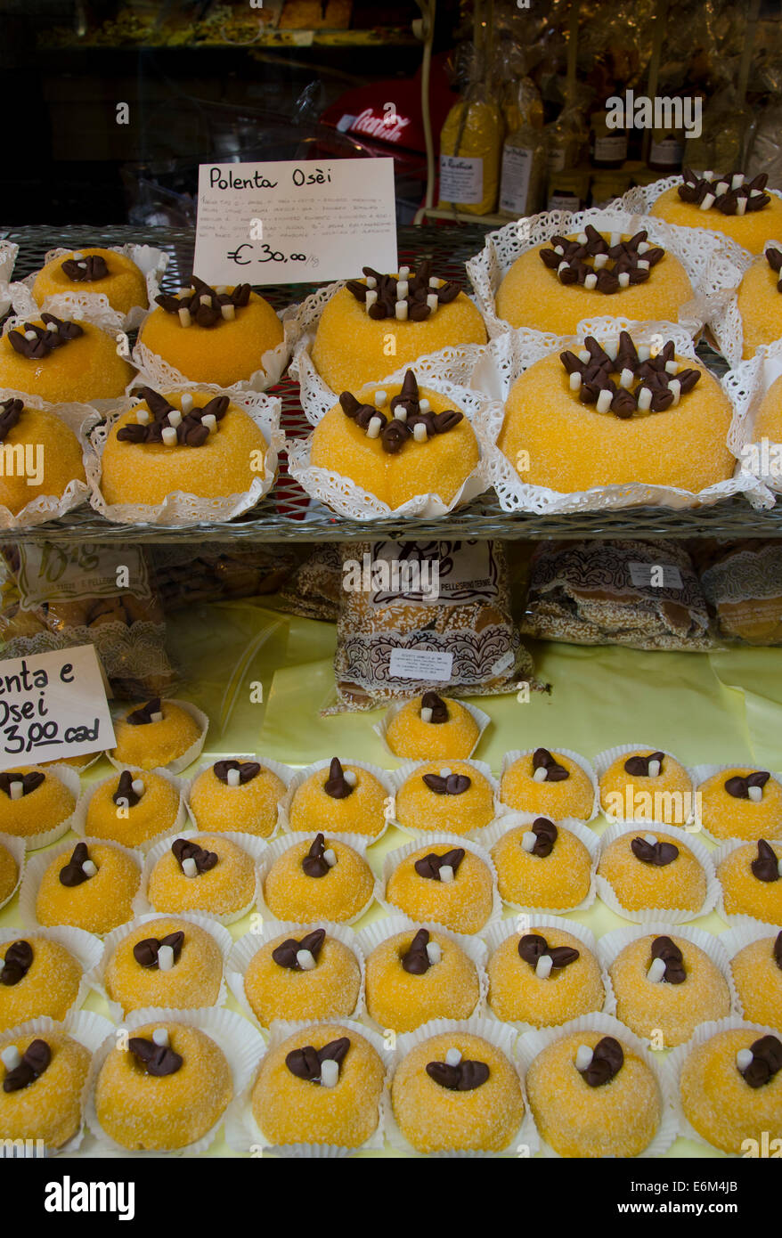 Polenta e osei pastry on display in store, filled with apricot jam