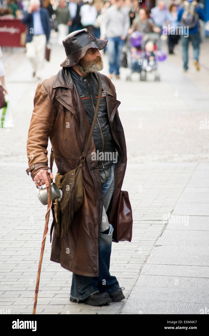 Traveling man on the streets of Galway, Ireland Stock Photo