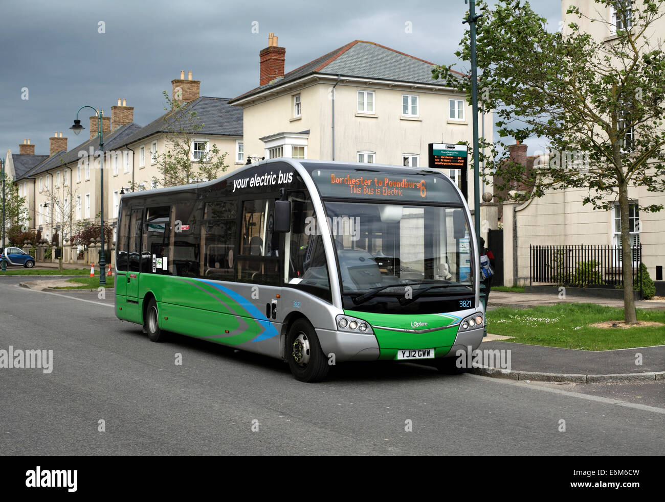 Electric bus in the Poundbury estate, Dorchester, Dorset. Stock Photo