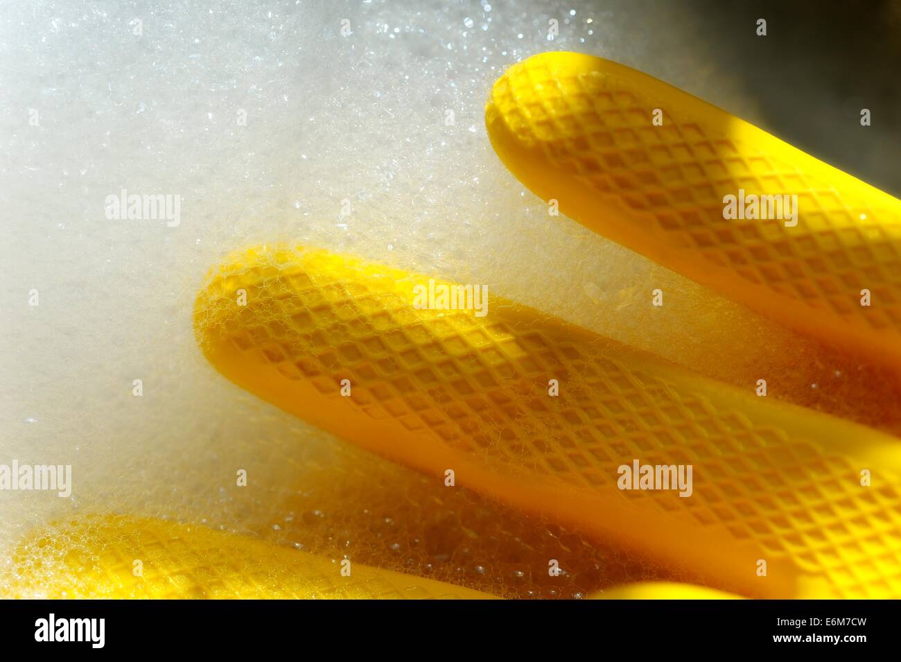 Yellow latex rubber gloves Stock Photo