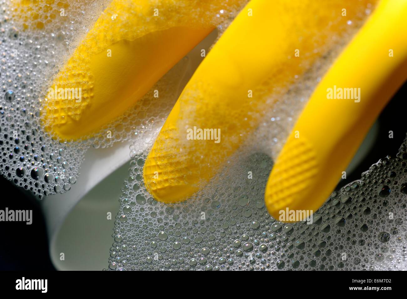 Yellow latex rubber gloves Stock Photo