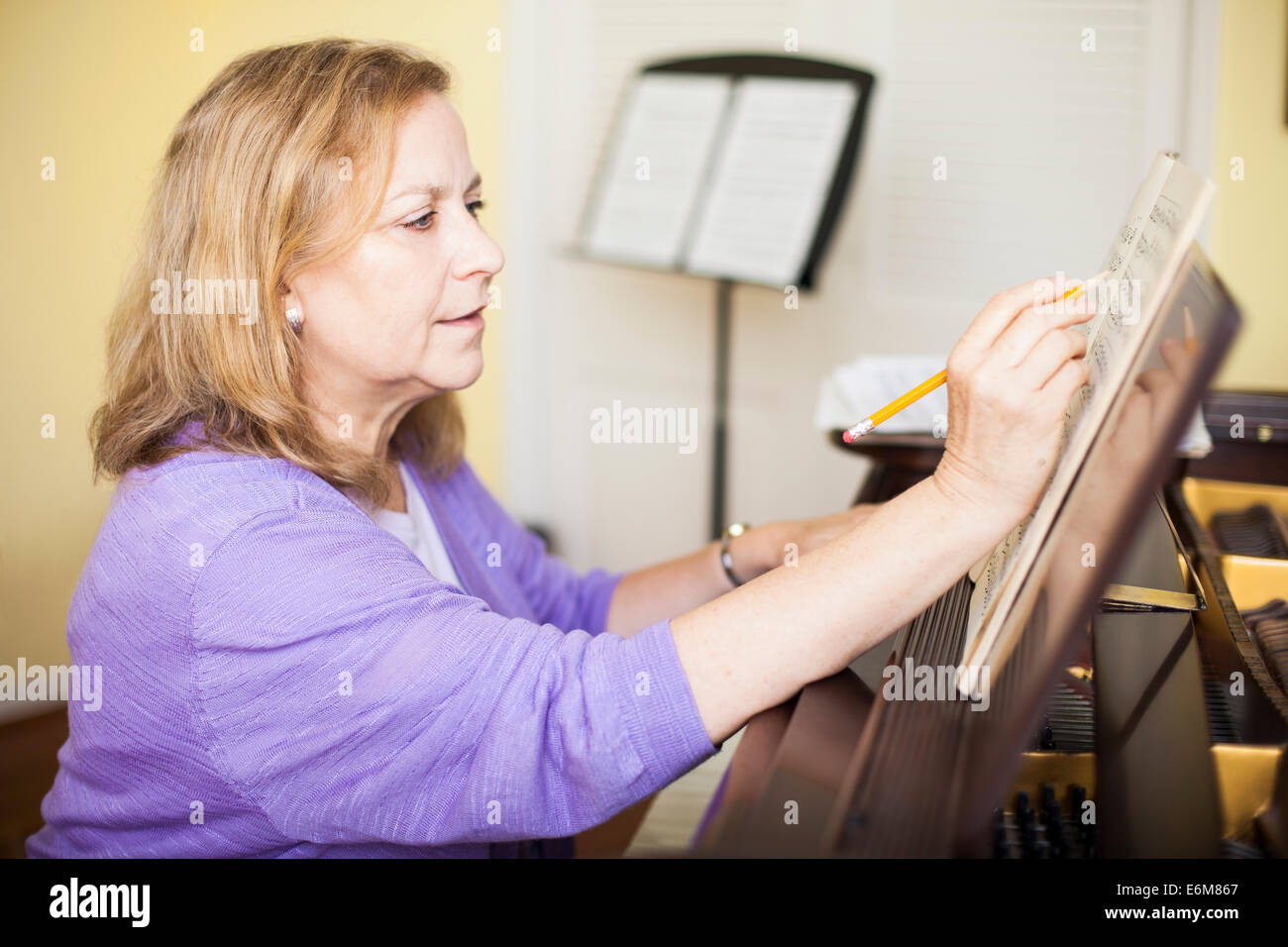 Senior woman checking notes Stock Photo