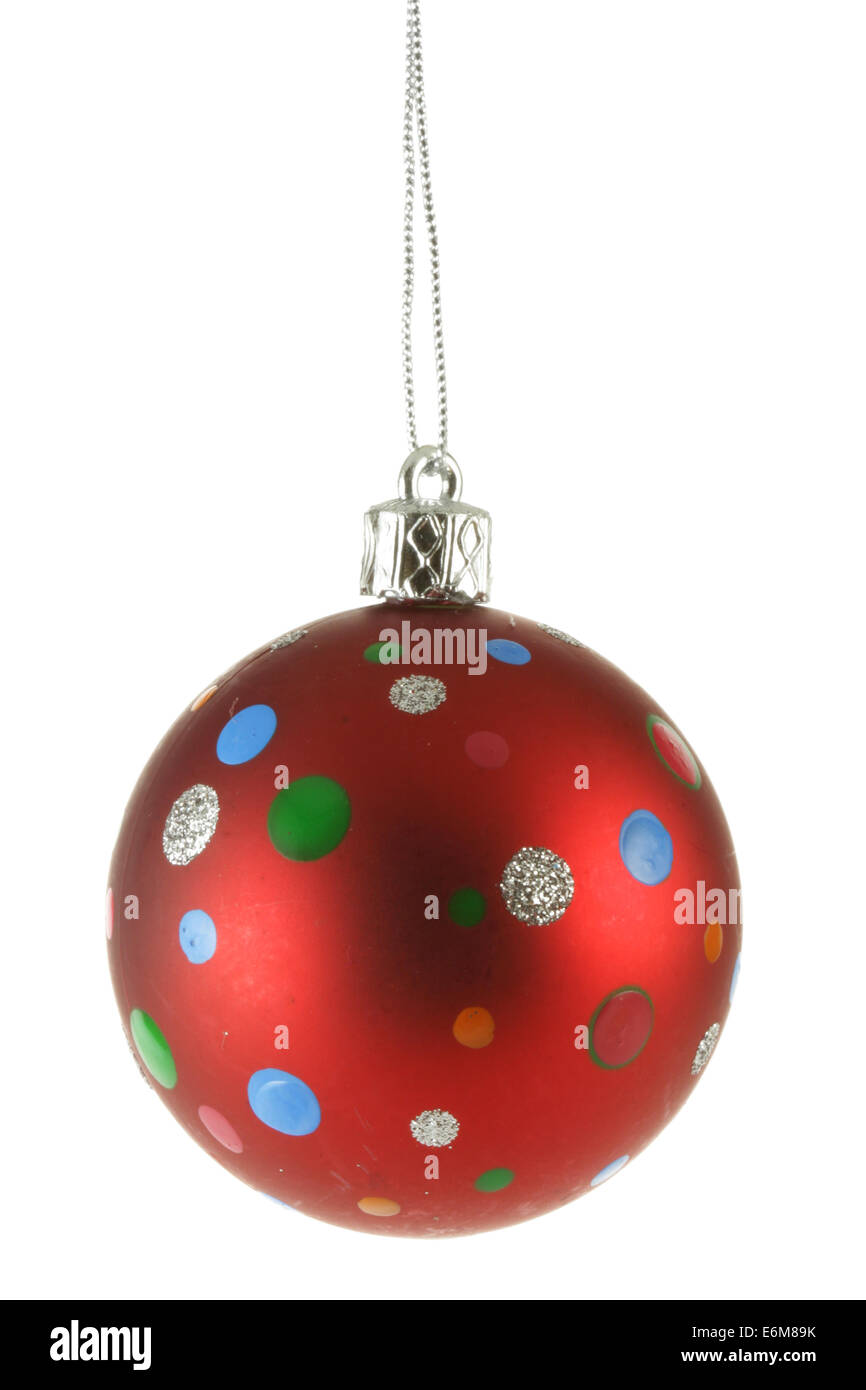 Red Christmas ball with colorful spots isolated over white background Stock Image