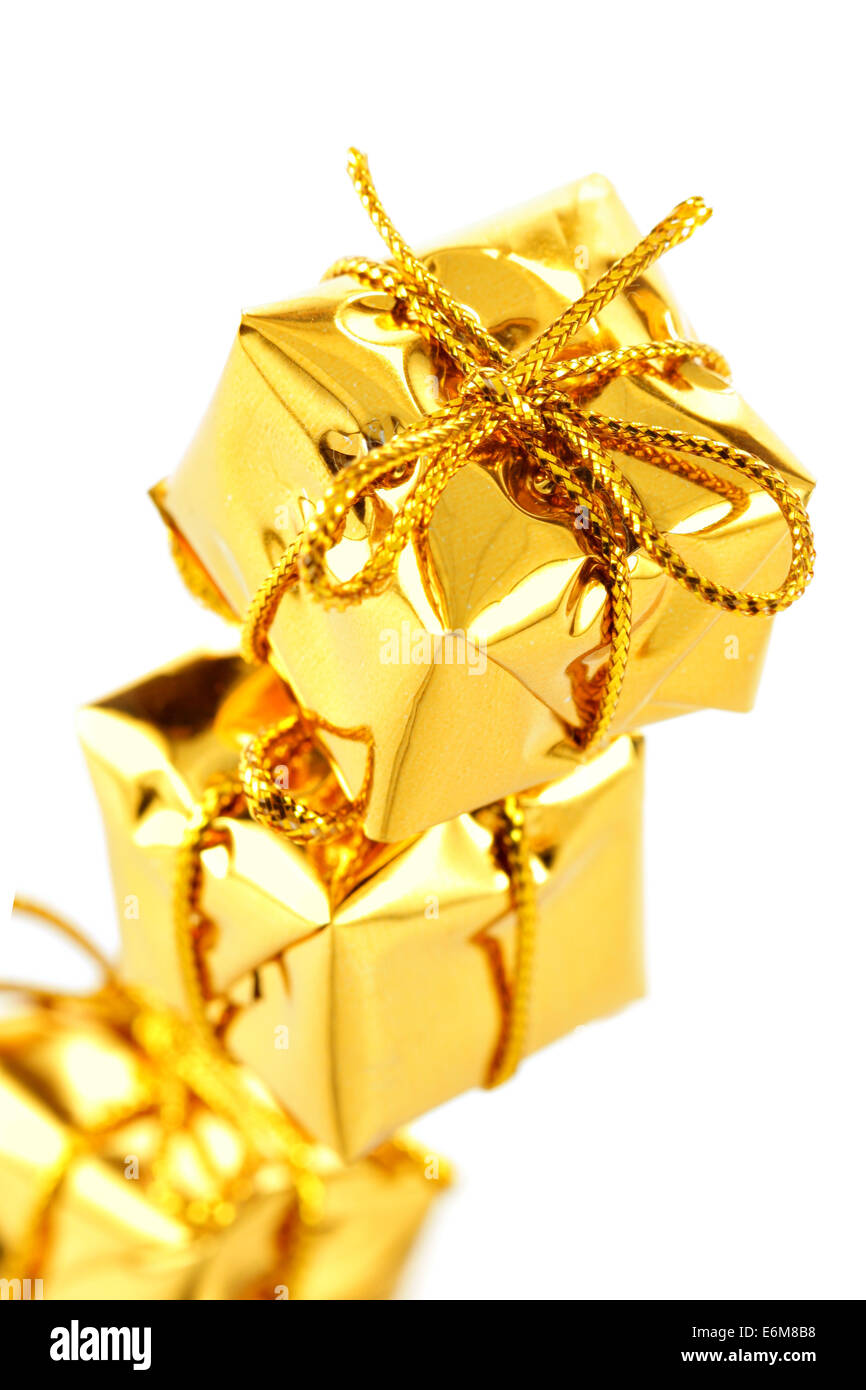 Three golden boxes isolated over white background Stock Photo