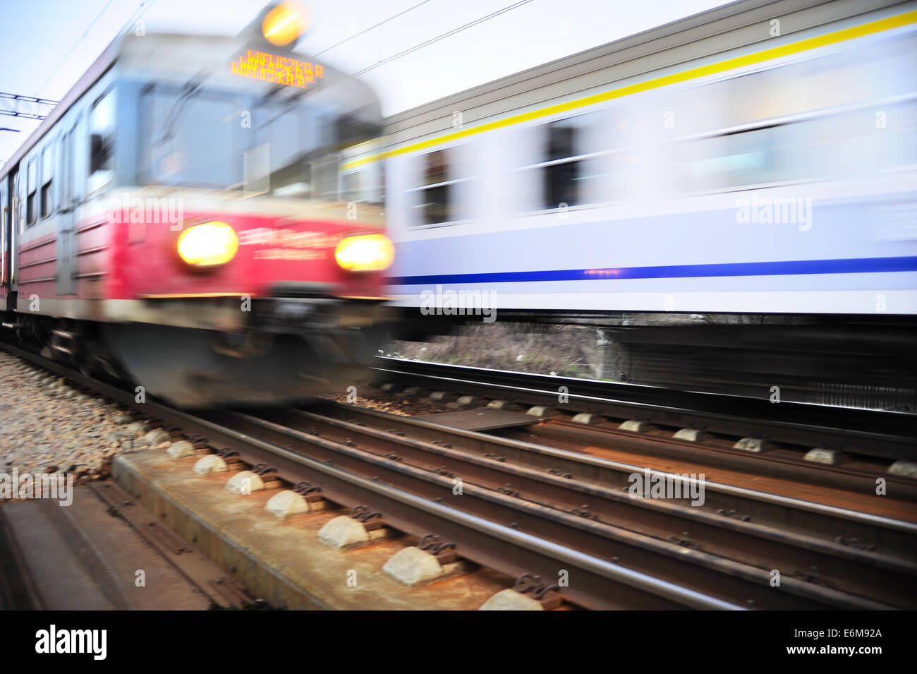 Fast moving trains in Krakow, Poland. Blurred motion Stock Photo
