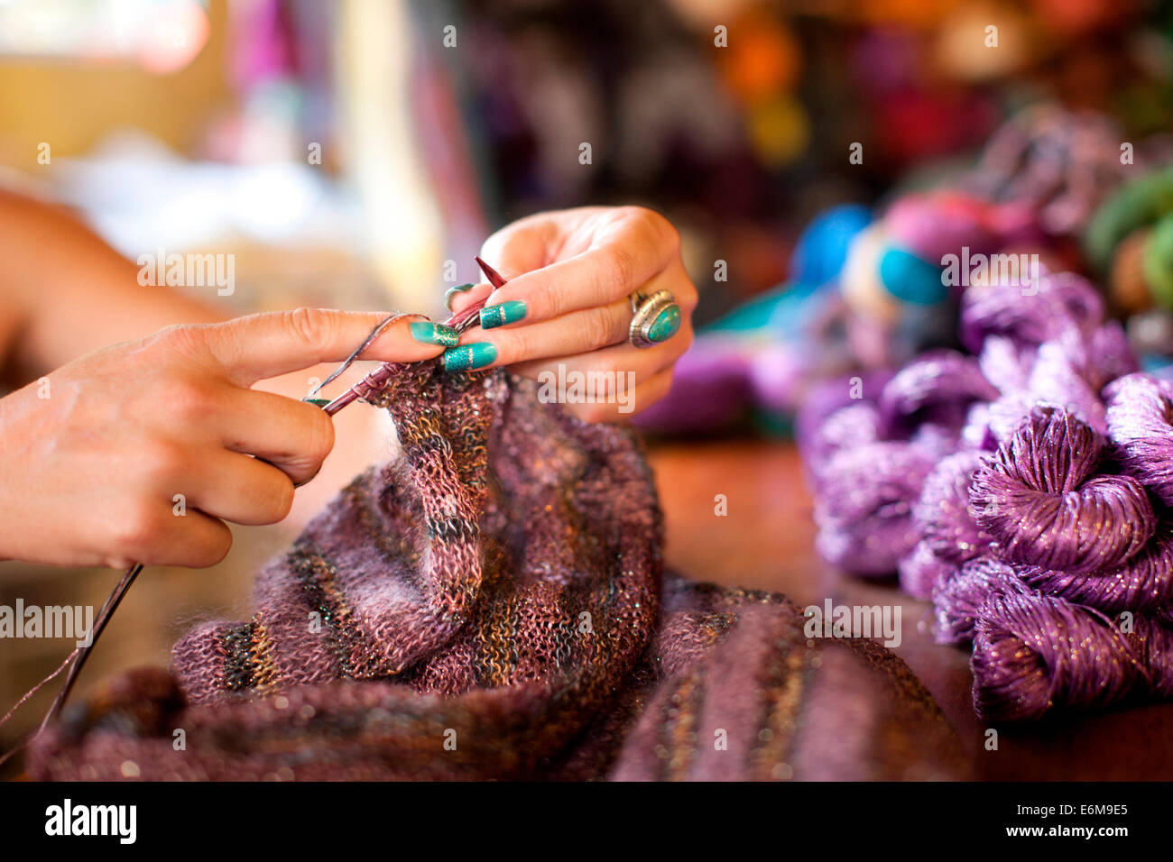 Close-up view of woman knitting Stock Photo