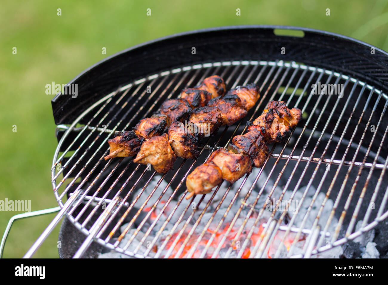 Barbecue Grill Filled With Burnt Meat Skewers Stock Photo Alamy