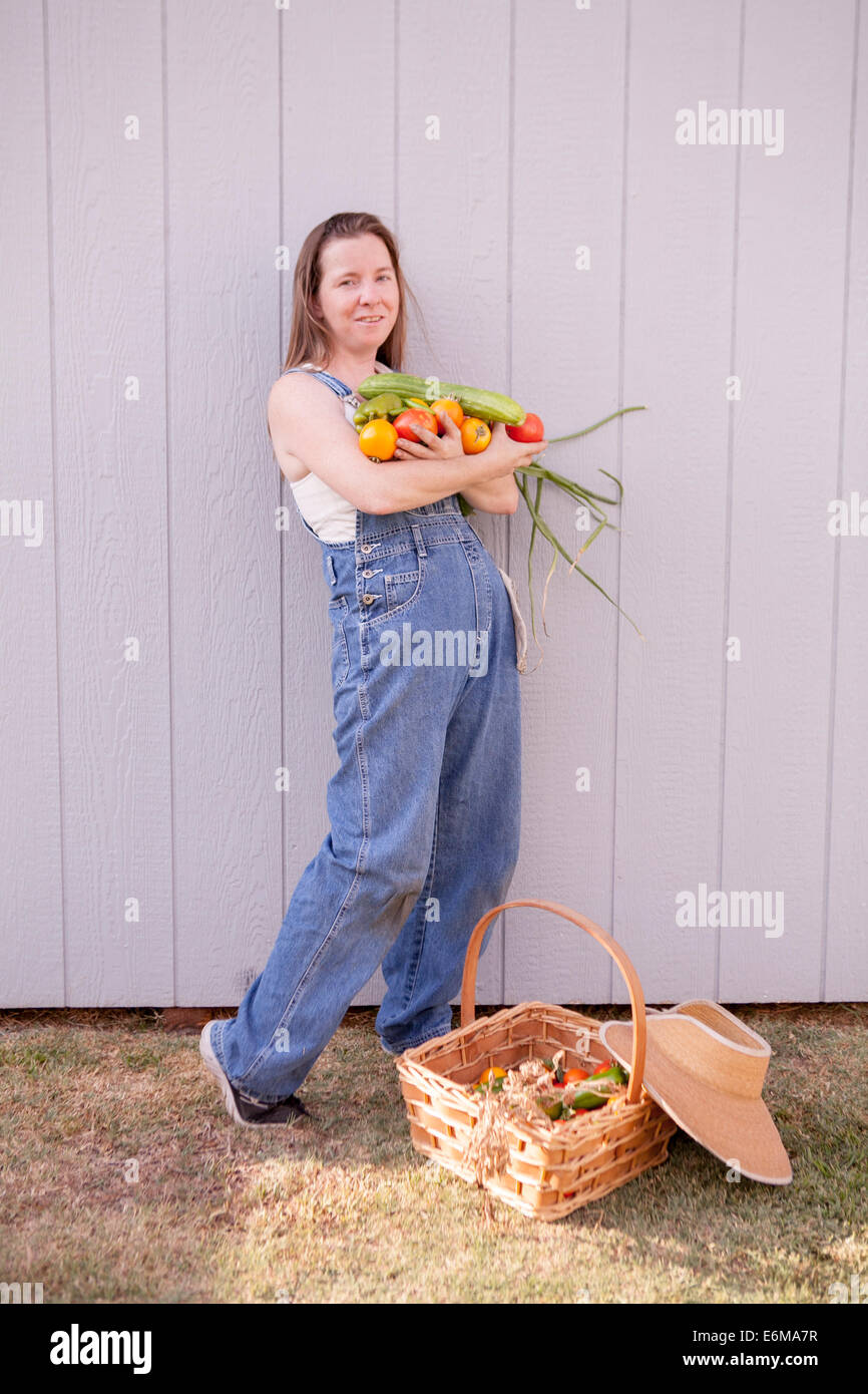 View of woman holding vegetables Stock Photo