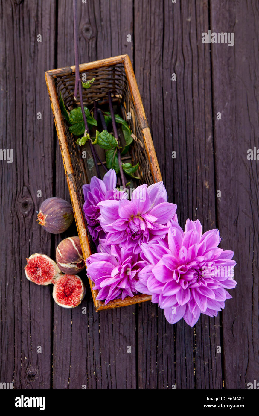 Closeup view of basket with flowers and fruit Stock Photo Alamy