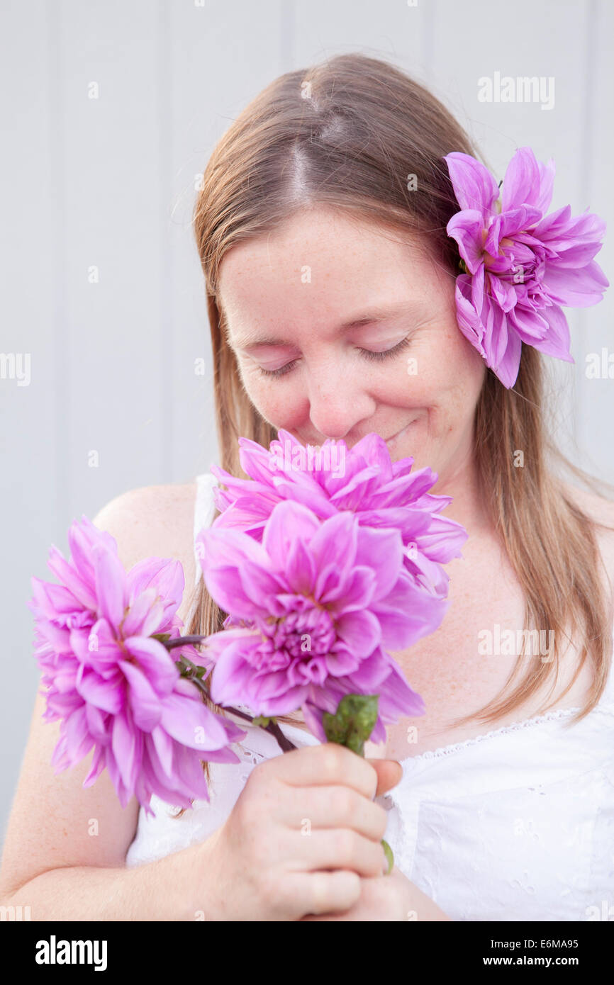 Portrait of woman with flowers Stock Photo