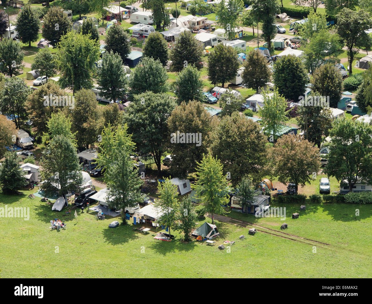 Busy camping site in sunny weather seen from above, Domaine de Chalain, Jura, France Stock Photo